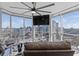 Cozy living room with leather sofa, city views, and large windows at 285 Centennial Olympic Park Dr # 1705, Atlanta, GA 30313