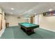 Basement game room with pool table, wood bar, and recessed lighting at 5077 Fieldview Dr, Douglasville, GA 30135