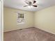 Bedroom featuring a ceiling fan, closet, and neutral carpet at 5077 Fieldview Dr, Douglasville, GA 30135