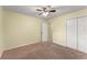 Bedroom with neutral walls, carpet flooring, and ceiling fan for a calming atmosphere at 5077 Fieldview Dr, Douglasville, GA 30135