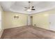 Large bedroom with a ceiling fan and neutral walls at 5077 Fieldview Dr, Douglasville, GA 30135