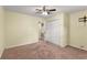 Bedroom featuring a ceiling fan, closet, and neutral carpet at 5077 Fieldview Dr, Douglasville, GA 30135