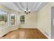 Dining room with hardwood floors, tray ceiling and modern chandelier at 5077 Fieldview Dr, Douglasville, GA 30135