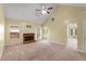 Bright living room featuring a fireplace, high ceilings, and ample natural light at 5077 Fieldview Dr, Douglasville, GA 30135