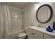 Bathroom with a shower and tub combination featuring subway tile and sleek fixtures at 77 Hunters Grn, Dallas, GA 30157