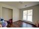 Bedroom with wood floors, neutral walls and a window providing ample natural light at 77 Hunters Grn, Dallas, GA 30157