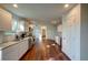 Spacious kitchen with white cabinets, granite countertops, stainless steel appliances, and hardwood flooring at 77 Hunters Grn, Dallas, GA 30157