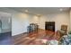 Spacious living room featuring wood floors, a fireplace, and a view to the home's entry at 77 Hunters Grn, Dallas, GA 30157