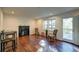 Spacious living room featuring wood floors, a fireplace, and access to a deck at 77 Hunters Grn, Dallas, GA 30157