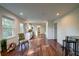 Open-concept living area with wood floors, leading to the kitchen with modern appliances at 77 Hunters Grn, Dallas, GA 30157