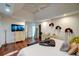 Bright main bedroom featuring a trey ceiling, hardwood floors, and two dressers at 77 Hunters Grn, Dallas, GA 30157