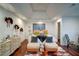 Comfortable main bedroom with hardwood floors, a seating area, and decorative wall art at 77 Hunters Grn, Dallas, GA 30157