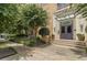 Beautiful building entrance featuring a glass awning, potted plants, and lush landscaping along the sidewalk at 794 Ralph Mcgill Ne Blvd # 8, Atlanta, GA 30312