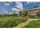 Exterior shot of the brick building on a beautiful day with lush green space, walking path, and blue skies at 794 Ralph Mcgill Ne Blvd # 8, Atlanta, GA 30312