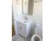 Bright bathroom with a white vanity, modern faucet, mirror, and toilet at 2215 Gordon Se Cir, Smyrna, GA 30080