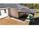 Side view of home featuring an attached carport with black posts and matching charcoal roof at 2215 Gordon Se Cir, Smyrna, GA 30080