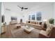 Bright living room with hardwood floors, neutral palette, and large windows that bring natural light at 2215 Gordon Se Cir, Smyrna, GA 30080