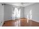 Spacious bedroom with hardwood floors and a bright window at 4142 Huntcliff Dr, Woodstock, GA 30189