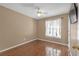 Neutral bedroom with hardwood floors, and natural light from the window at 4142 Huntcliff Dr, Woodstock, GA 30189