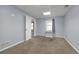 Bedroom with carpet flooring, neutral walls, a window with seating, and ample natural light at 4142 Huntcliff Dr, Woodstock, GA 30189