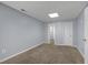 Bedroom with carpet flooring and neutral walls, showcasing a walk-in closet at 4142 Huntcliff Dr, Woodstock, GA 30189