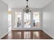 Light-filled dining area with a chandelier and a view of the backyard at 4142 Huntcliff Dr, Woodstock, GA 30189