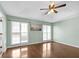 Bright main bedroom featuring a tray ceiling, hardwood floors, and plenty of light at 4142 Huntcliff Dr, Woodstock, GA 30189