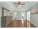 Large main bedroom with hardwood floors, a dresser, and a view to the ensuite at 4142 Huntcliff Dr, Woodstock, GA 30189