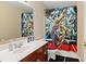 Bathroom featuring a vanity, toilet and a shower with a colorful artistic shower curtain at 1536 Granby Ln, Locust Grove, GA 30248