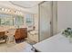 Bathroom showcasing a tub, shower, vanity, mirror and white tiled flooring at 1536 Granby Ln, Locust Grove, GA 30248
