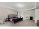 Primary bedroom with tray ceilings, carpeted floor, double doors and an electric fireplace at 1536 Granby Ln, Locust Grove, GA 30248
