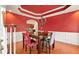 Cozy dining room featuring hardwood floors, chandelier, and archway into another room at 1536 Granby Ln, Locust Grove, GA 30248