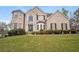 Charming brick home featuring well-manicured landscaping and a welcoming front entrance at 1536 Granby Ln, Locust Grove, GA 30248
