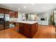 Modern kitchen with stainless steel appliances, center island, and dark wood cabinets at 1536 Granby Ln, Locust Grove, GA 30248