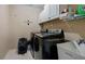 Laundry room featuring cabinets, appliances and a utility sink, and a laundry wall sign at 1536 Granby Ln, Locust Grove, GA 30248