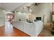 Spacious living area with hardwood floors, a ceiling fan, and an open floor plan at 1536 Granby Ln, Locust Grove, GA 30248