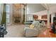 Open living room with fireplace and lots of natural light from the large windows at 1536 Granby Ln, Locust Grove, GA 30248