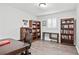 Bedroom with wood floors and built in wooden shelves at 3811 Lavilla Dr, Powder Springs, GA 30127
