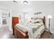 Bedroom features a wood bed frame, wood floors, and neutral wall paint at 3811 Lavilla Dr, Powder Springs, GA 30127