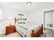 Bedroom with a wood bed frame and modern decor, creating a relaxing retreat at 3811 Lavilla Dr, Powder Springs, GA 30127