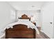 Bedroom with dark wood bed frame and wood floors at 3811 Lavilla Dr, Powder Springs, GA 30127