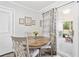 Cozy dining area with charming decor and screened porch view at 3811 Lavilla Dr, Powder Springs, GA 30127