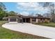 Charming brick home with a long driveway, carport, and detached garage at 3811 Lavilla Dr, Powder Springs, GA 30127