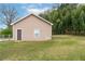 Side view of the detached garage with a single window and a door on the side at 3811 Lavilla Dr, Powder Springs, GA 30127