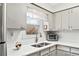 Bright kitchen features white cabinets, subway tile backsplash, and stainless steel appliances at 3811 Lavilla Dr, Powder Springs, GA 30127