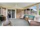 Cozy sunroom with brick walls, ample seating, and an inviting atmosphere at 3811 Lavilla Dr, Powder Springs, GA 30127