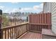 A wooden balcony overlooks trees with additional townhomes visible in the distance at 4125 Barry Pl, Chamblee, GA 30341