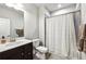Bathroom with a combination shower and tub, vanity, and neutral color scheme at 4125 Barry Pl, Chamblee, GA 30341