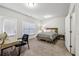 Cozy bedroom with neutral walls, carpet, and ample natural light from windows at 4125 Barry Pl, Chamblee, GA 30341