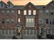 Attractive townhome exteriors with brick and stone accents and attached garages at 4125 Barry Pl, Chamblee, GA 30341